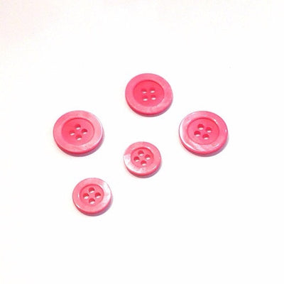 Bright-pink-shiny-plastic-button